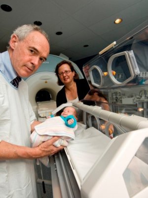 Professor Paul Colditz and Professor Roslyn Boyd with the first preterm baby to be scanned using the MR compatible incubator, which is used to detect cerebral palsy. Professor Paul Colditz and Professor Roslyn Boyd with the first preterm baby to be scanned using the MR compatible incubator, which is used to detect cerebral palsy.